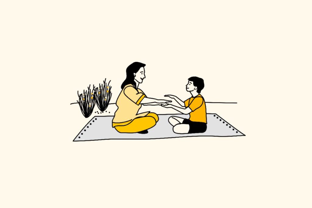 Yellow tile with illustration of parent and child sitting on picnic rug